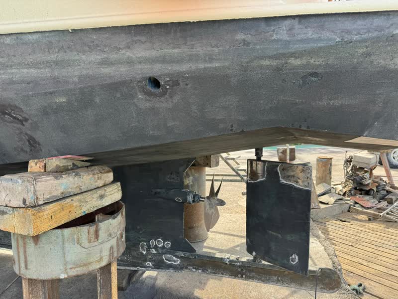 Under the stern of the Gypsy Life: ice propeller and rudder between the guard plates